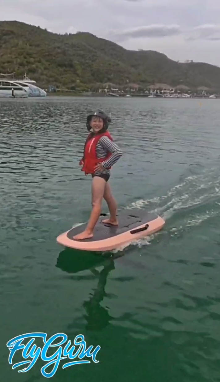 Beginner standing on an eFoil during the first session