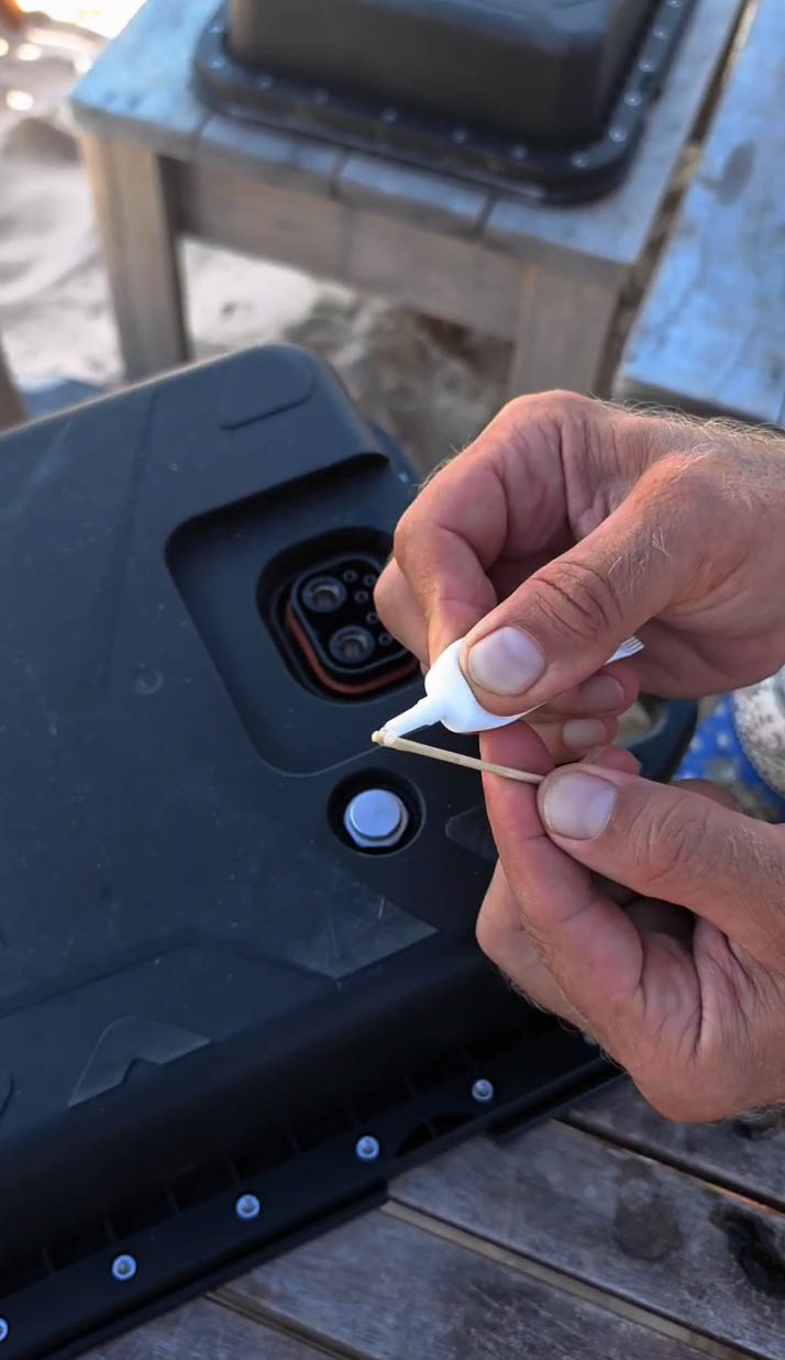 Applying silicone grease near battery connector gasket